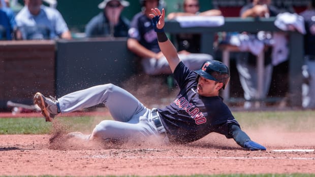 Jun 29, 2023; Kansas City, Missouri, USA; Cleveland Guardians left fielder Steven Kwan (38) slides across home plate during the fifth inning against the Kansas City Royals at Kauffman Stadium. Mandatory Credit: William Purnell-USA TODAY Sports